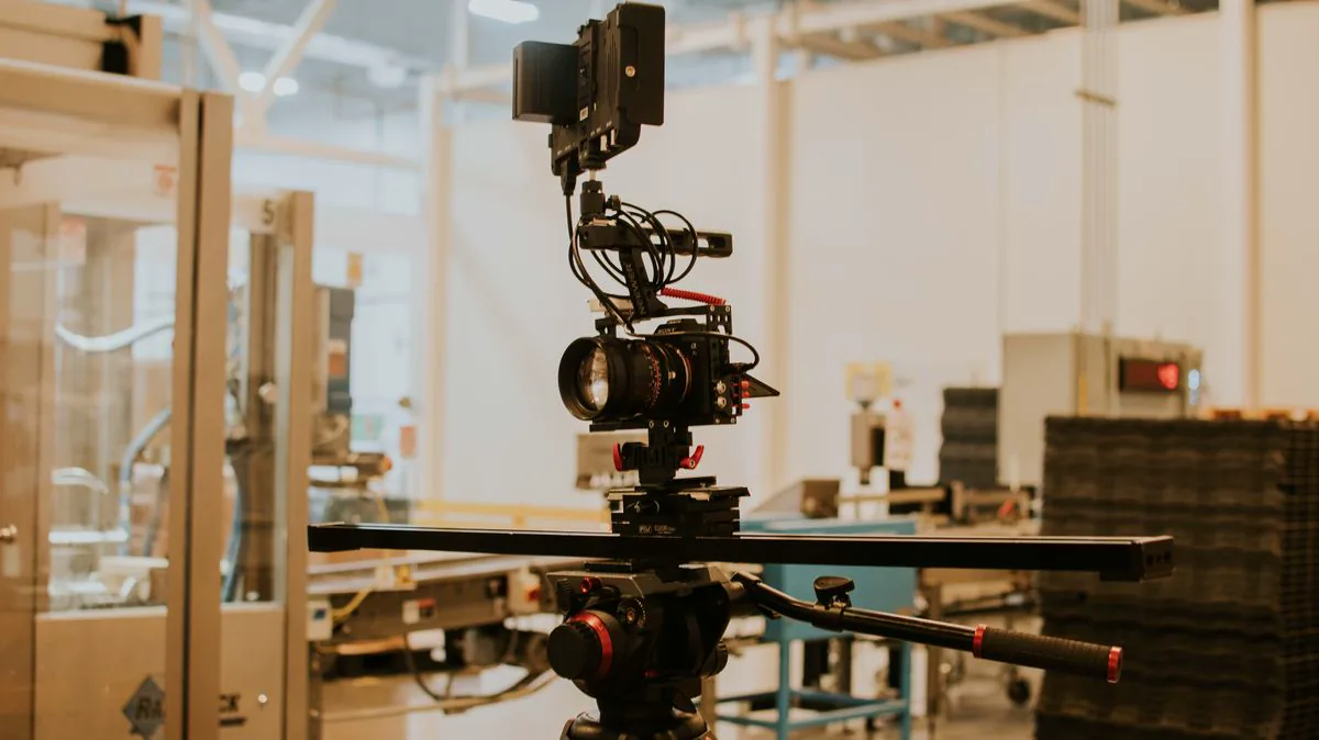 Cinema camera mounted on a slider for a controlled product-video shoot.