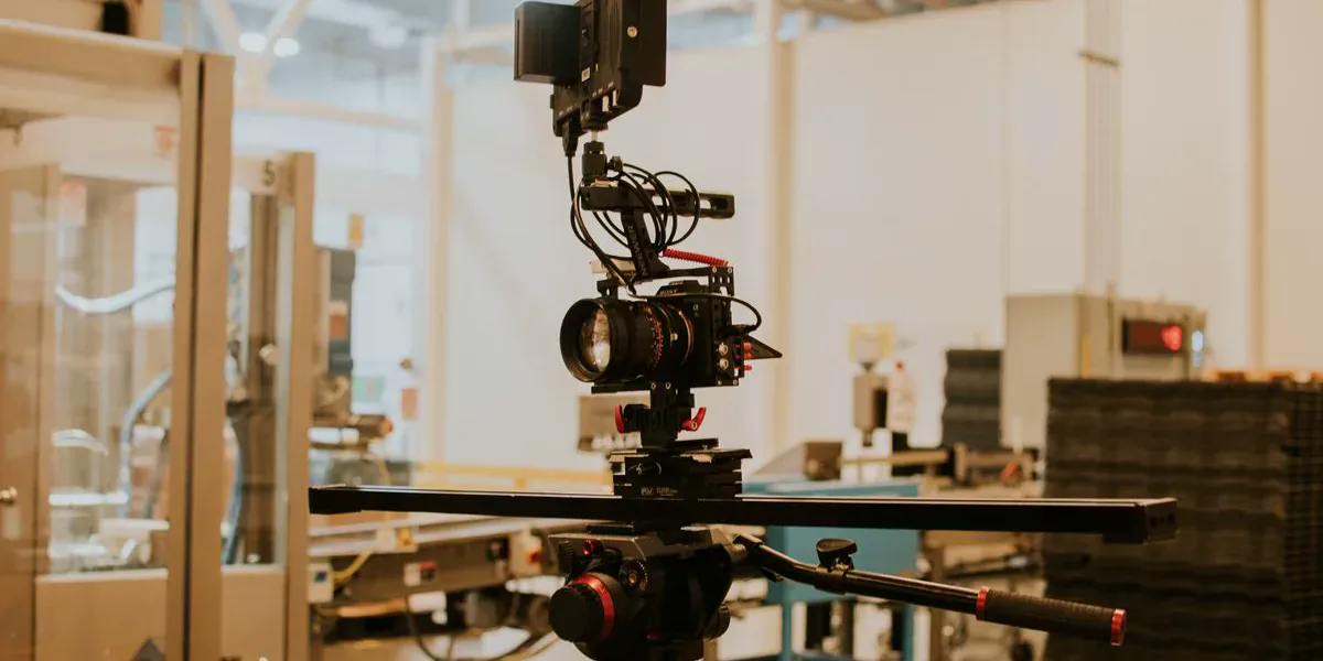 Professional cinema camera and slider equipment included in a video production budget