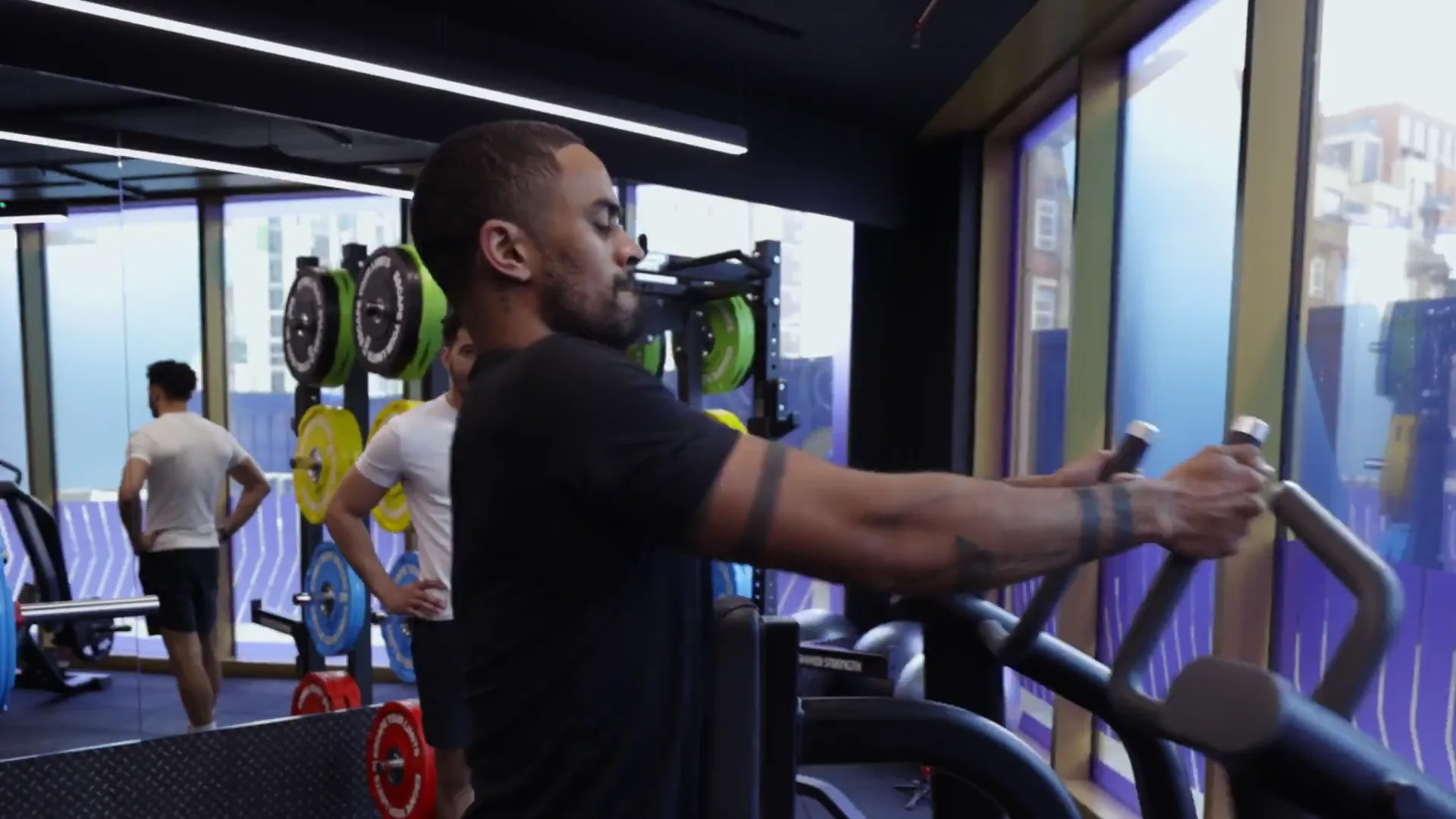A gym member using resistance equipment