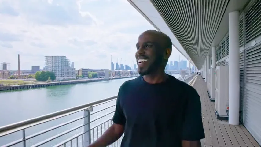 A contributor on the ExCeL London balcony beside the Royal Docks