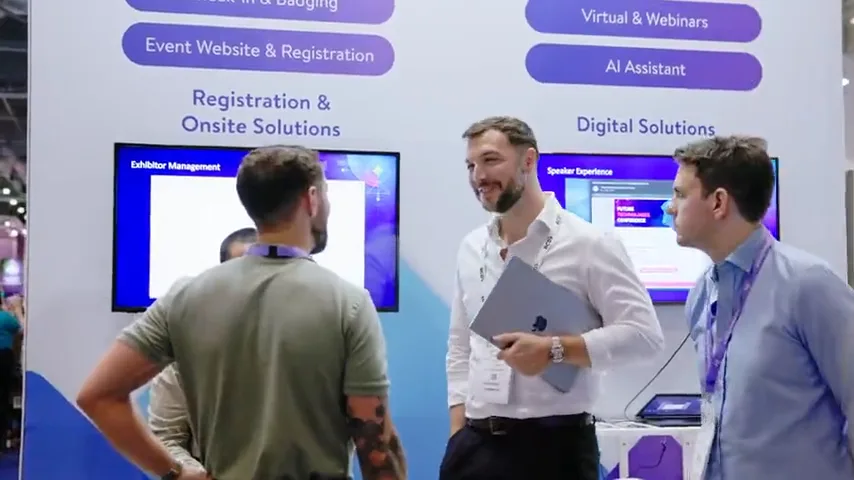 Exhibitors discussing digital event solutions at a stand