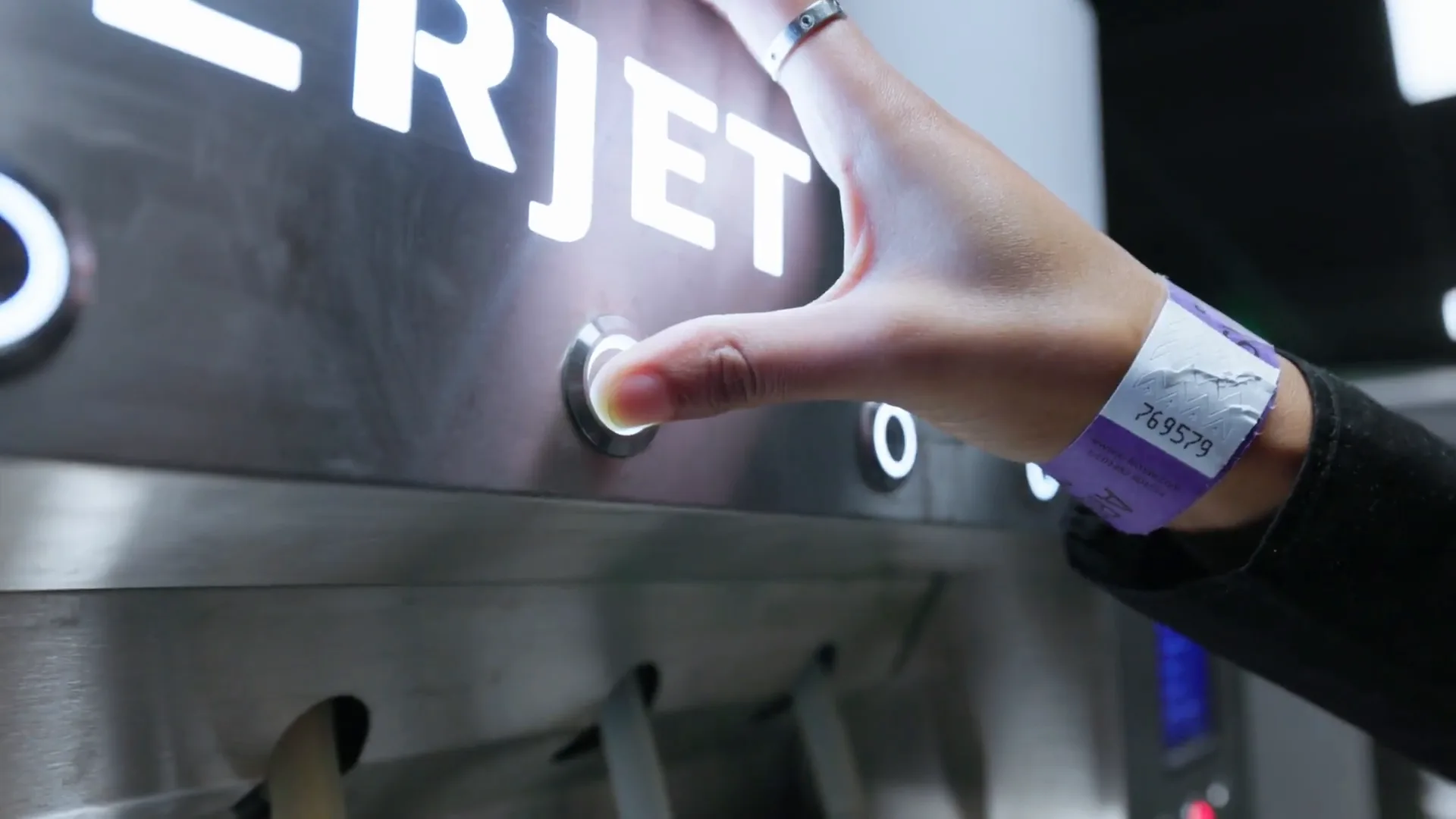 A visitor tapping the Frictionless Bar interface