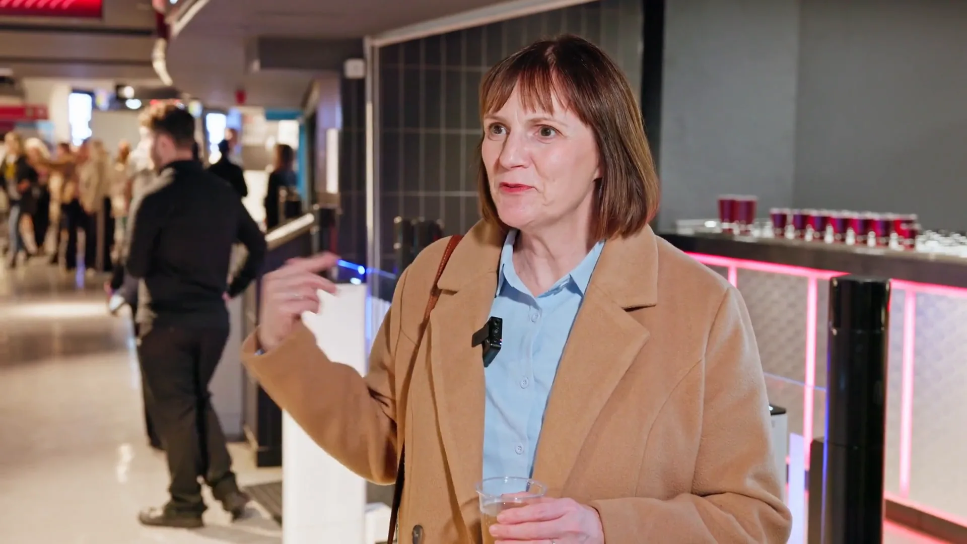 A second contributor speaking beside the working bar