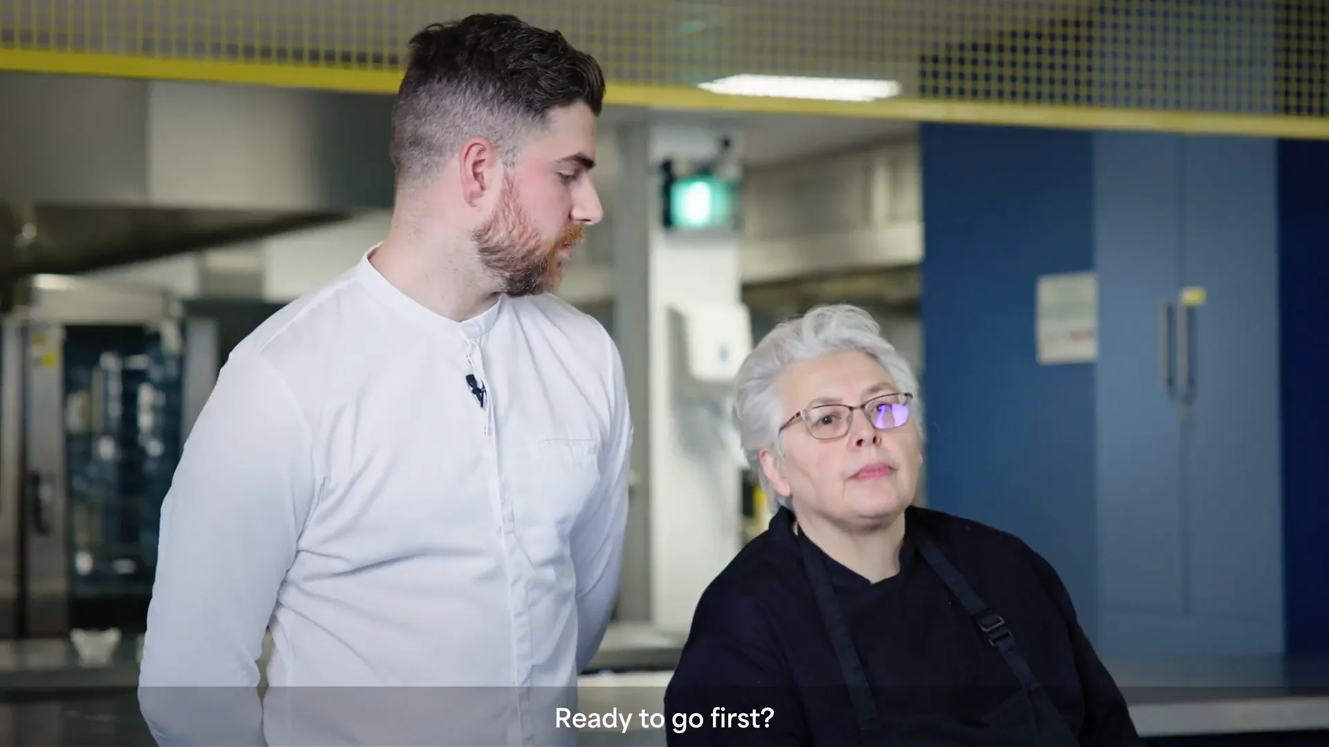Two participants speaking in the Game On kitchen