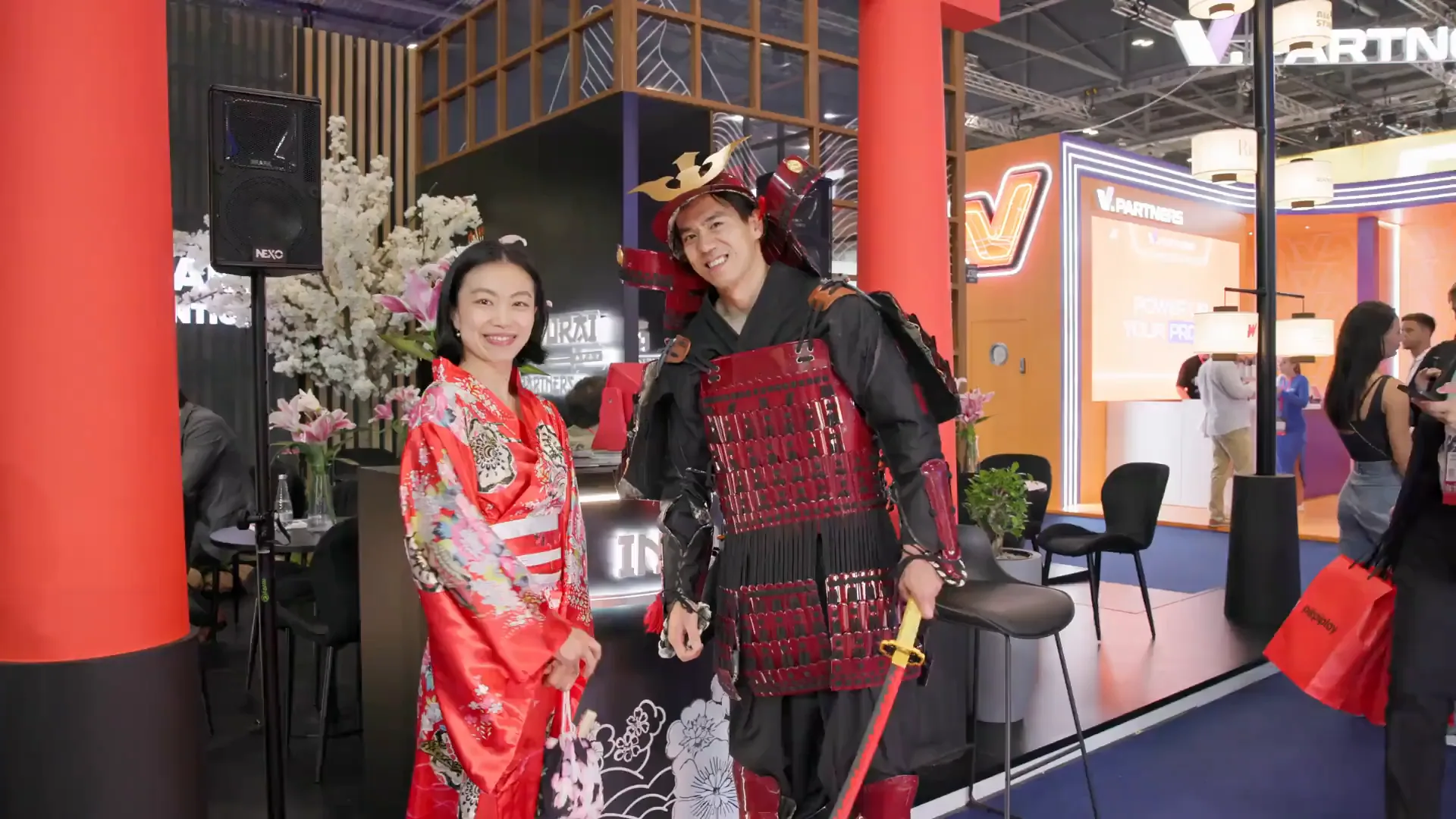 Two stand representatives in distinctive costume at iGB L!VE