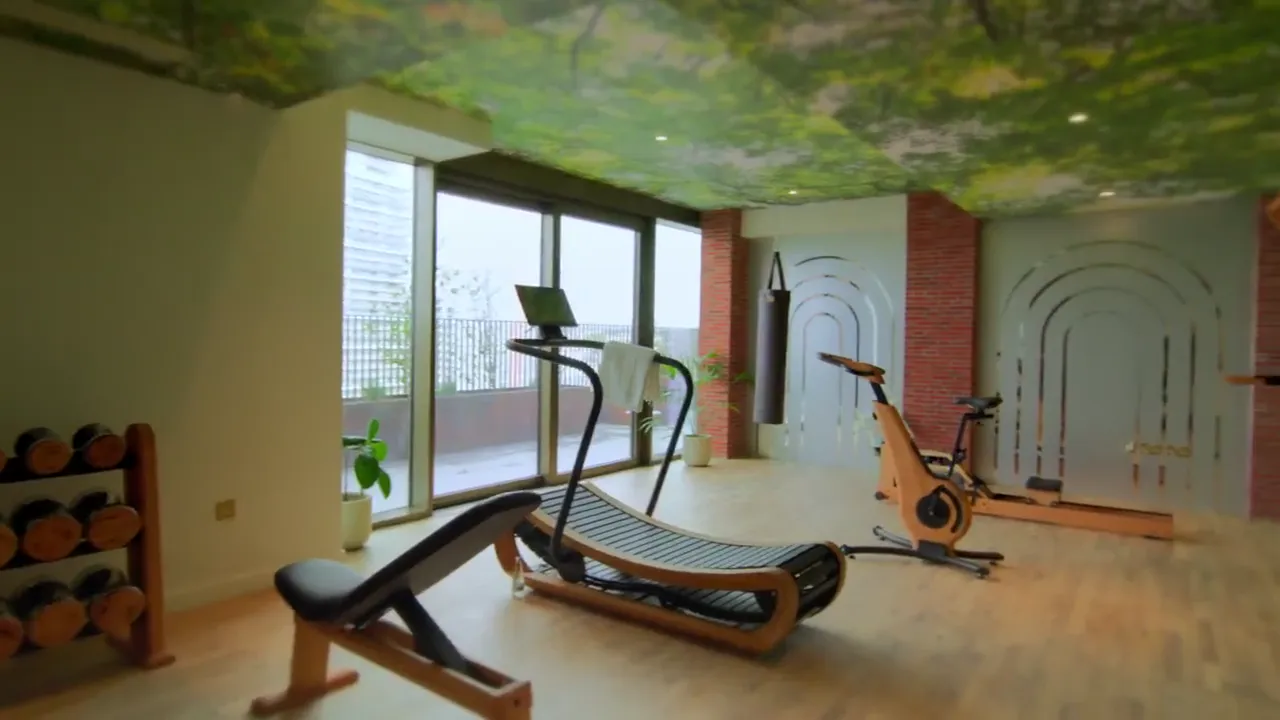 The Arc fitness room beneath a green ceiling