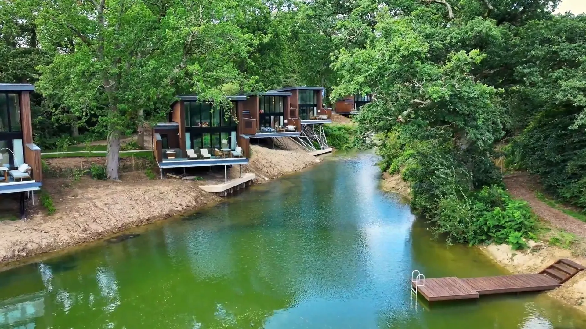 The Reeds lodges arranged around the water at South Lodge