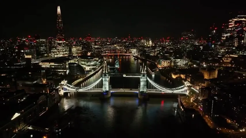 Tower Bridge illuminated above the River Thames at night