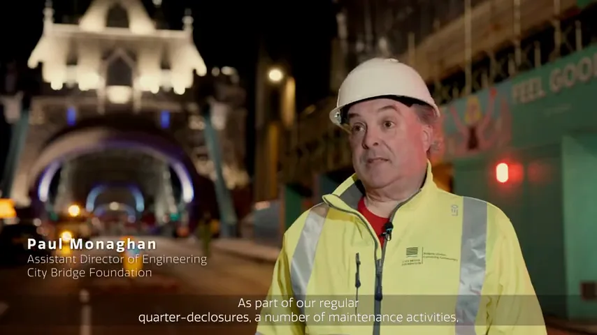 A Tower Bridge maintenance contributor speaking beside the bridge